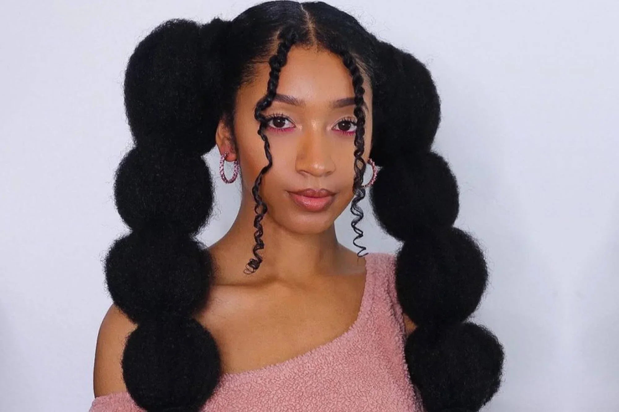 Timeless Hair Braid Styles for Black Hair That Celebrate Beauty and Strength 4 https://carolsdaughter.com/cdn/shop/articles/Dec22-Influencer-your-step-by-step-guide-to-creating-bubble-braids-on-natural-hair__ciara_f024645d-e2dc-4a33-b046-8bd5225d2166.webp?v=1754606288