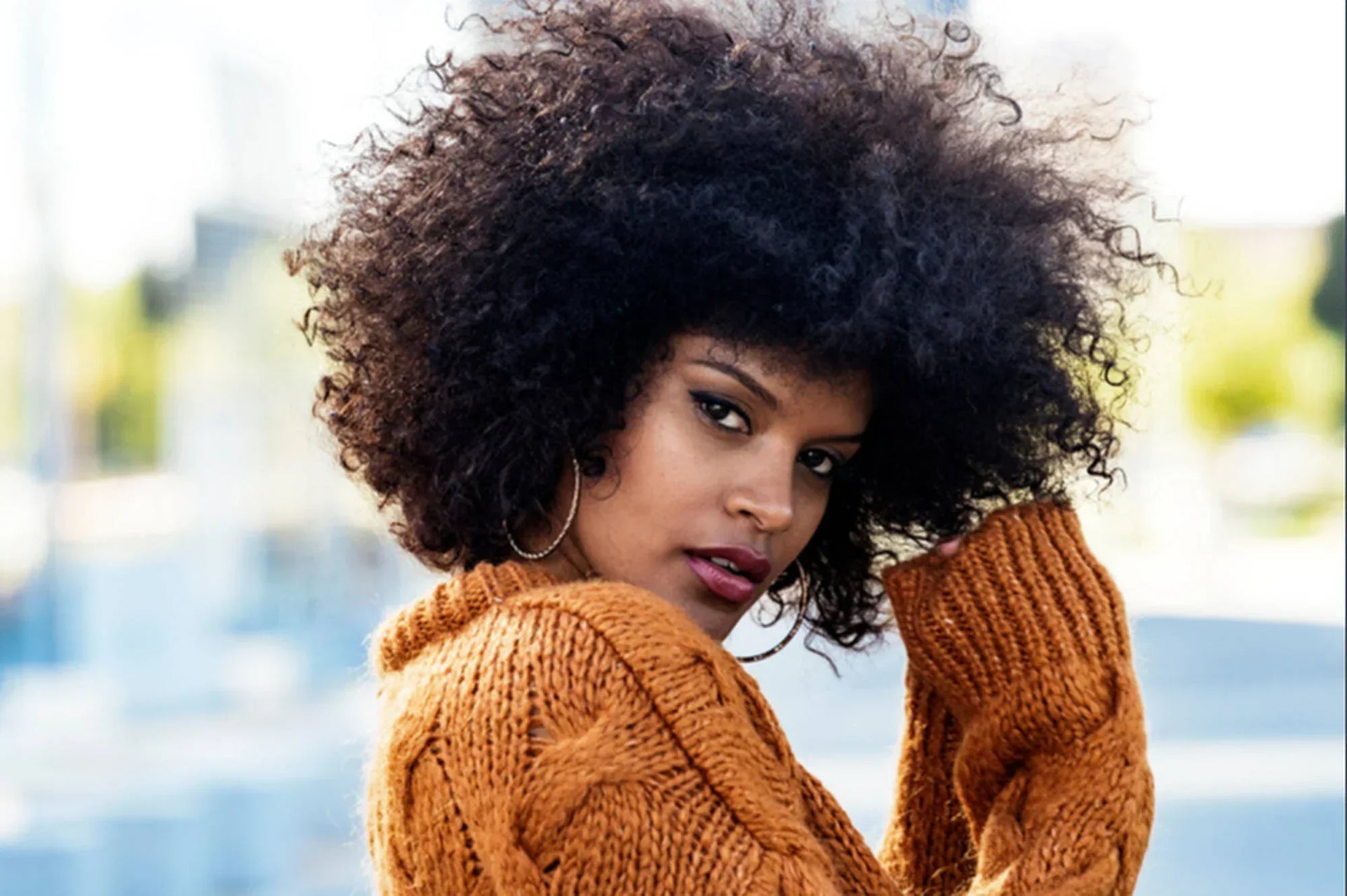How to Tame Frizzy Hair: 16 Tips for Smoother, Defined Curls