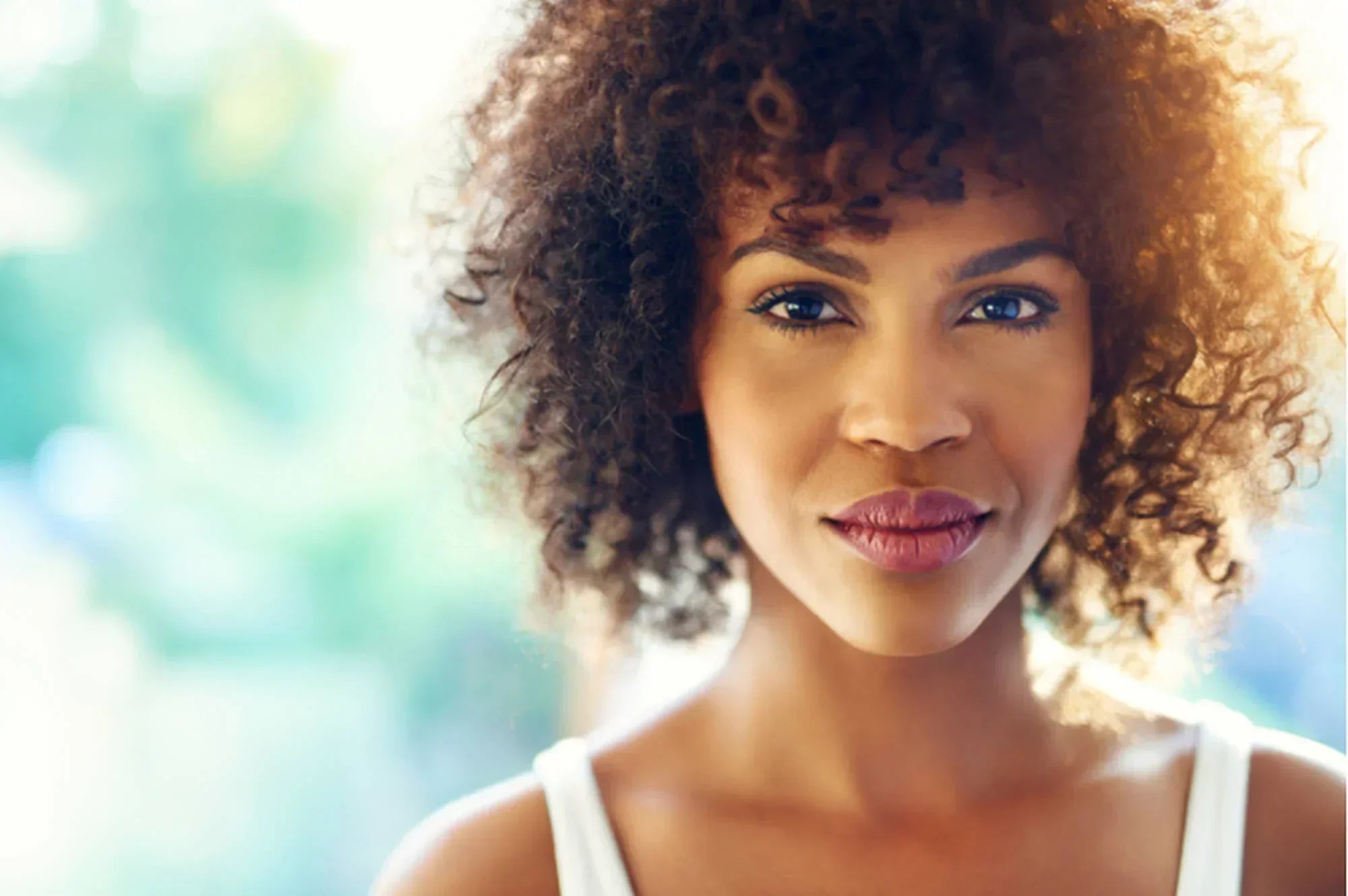 How to Cut and Style Bangs If You Have Curly Hair